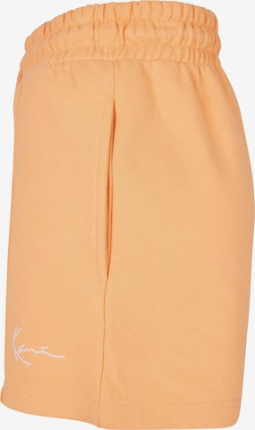 regular Pantaloni di Karl Kani in arancione