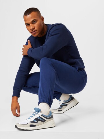 Nike Sportswear Tapered Broek in Blauw