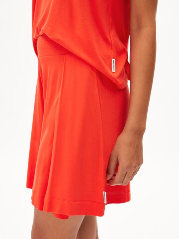 ARMEDANGELS Loose fit Trousers 'AAREZU' in Orange