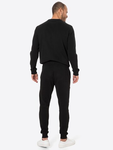 AllSaints Tapered Nadrág 'Raven' - fekete