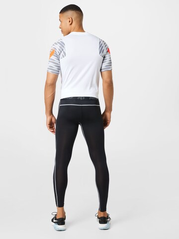 NIKE Skinny Sporthose in Schwarz
