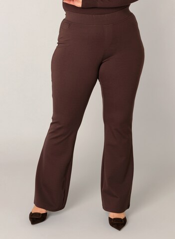BASE LEVEL CURVY Flared Pants in Brown: front