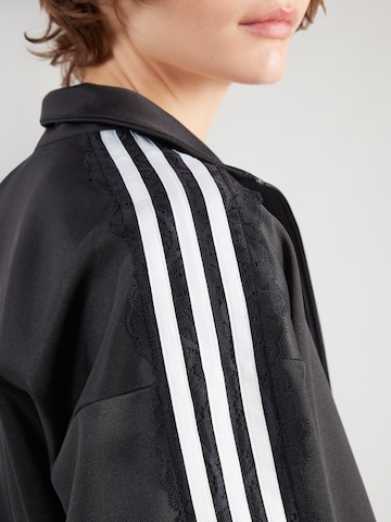 ADIDAS ORIGINALS - Chaqueta de entretiempo en negro