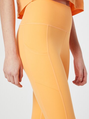 Skinny Pantaloni sportivi 'HEART INTO IT' di ROXY in arancione