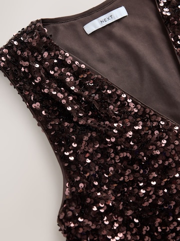 Top de la Next pe maro