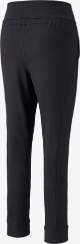 PUMA Tapered Sports trousers in Black