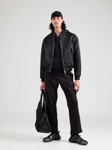 Regular Pantalon de sport Reebok en noir