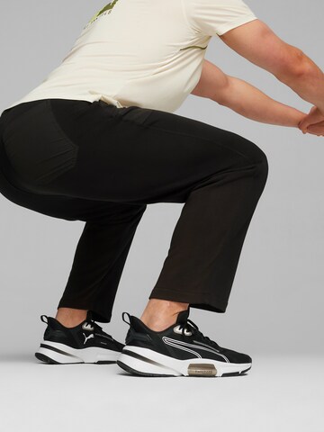 PUMA Normalny krój Spodnie sportowe 'Concept' w kolorze czarny