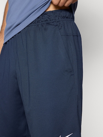 NIKE Свободный крой Спортивные штаны 'FLEX' в Синий