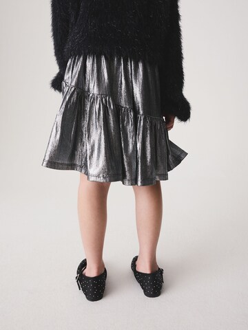 Next - Falda en plata