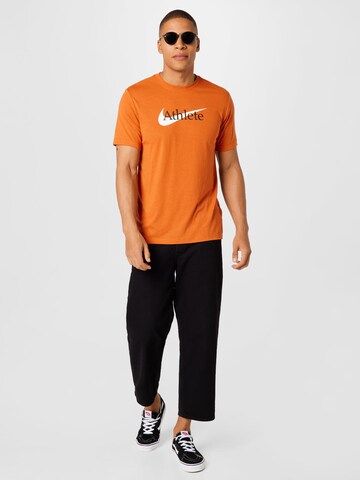 NIKERegular Fit Tehnička sportska majica 'Athlete' - narančasta boja