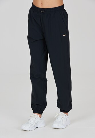 Athlecia Tapered Sports trousers 'Hero' in Black: front
