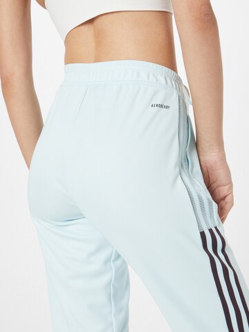 ADIDAS SPORTSWEAR - Tapered Pantalón deportivo 'Tiro' en azul