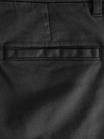 Slimfit Pantaloni chino di Next in nero