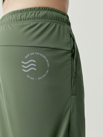 Born Living Yoga Regular Workout Pants 'Orinoco' in Green