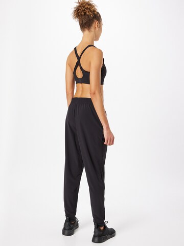 ADIDAS SPORTSWEAR Tapered Workout Pants 'Versatile Train ' in Black