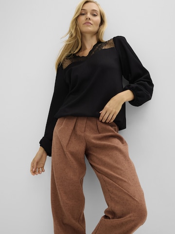 bonprix - Blusa en negro