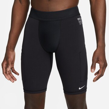 NIKE Skinny Sportbroek 'A.P.S.' in Zwart