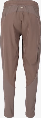 Athlecia Regular Workout Pants 'Timmie' in Beige
