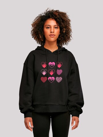 Sweat-shirt 'Internationaler Frauentag: Herzen in Flammen' F4NT4STIC en noir : devant
