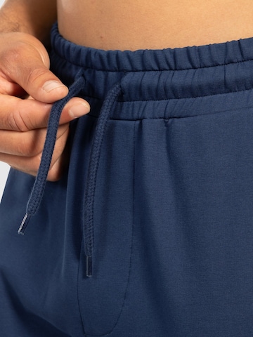 Effilé Pantalon de sport 'Nilo' Smilodox en bleu