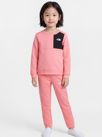 THE NORTH FACE Strój treningowy w kolorze różowy: przód