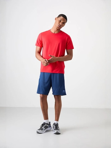 T-Shirt fonctionnel Tommy Life en rouge