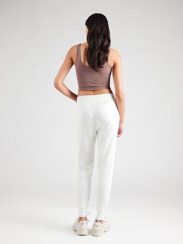 UNDER ARMOUR - Tapered Pantalón deportivo en gris