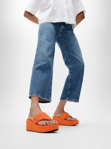 FitFlop T-Bar Sandals in Orange: front