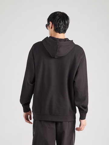 PUMA Sweatshirt 'ESS' in Black