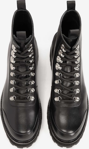 juoda Kazar Studio Auliniai batai su raišteliais