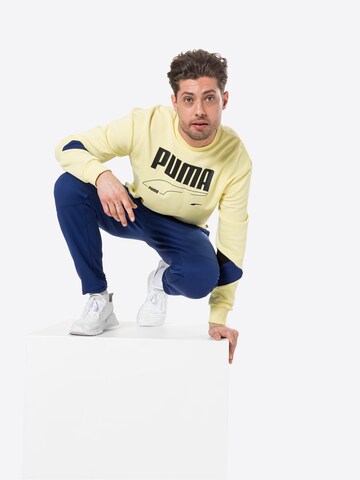 PUMA Sportsweatshirt 'Rebel' in Geel