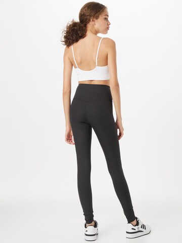 Girlfriend Collective Skinny Sporthose in Schwarz