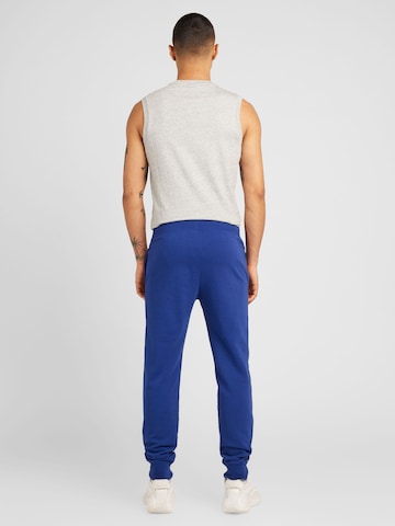 Tapered Pantaloni 'Legacy' de la Champion Authentic Athletic Apparel pe albastru