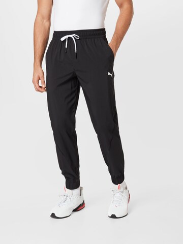 PUMA Tapered Workout Pants 'Train Vent' in Black: front