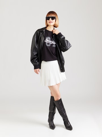 Maglietta di GUESS JEANS in nero
