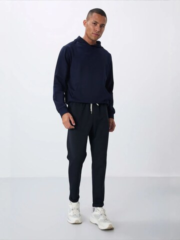 Effilé Pantalon de sport 'Jogginghose' Tommy Life en noir