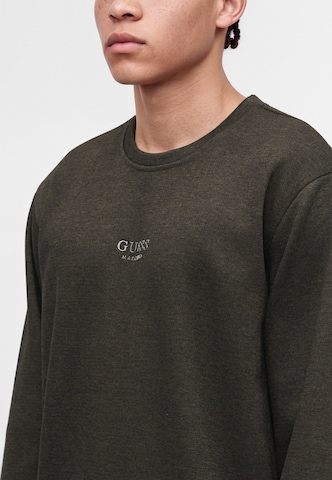 GUESS - Sudadera en marrón