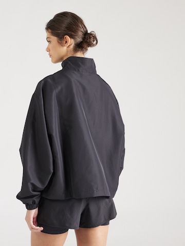 new balance Prehodna jakna | črna barva
