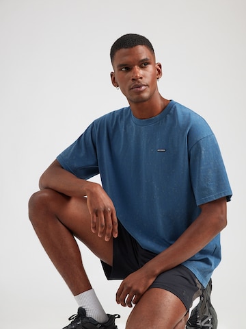 T-Shirt fonctionnel UNDER ARMOUR en bleu : devant