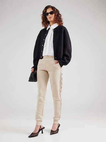 GUESS - Tapered Pantalón deportivo 'BRITNEY' en gris