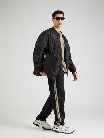 ELLESSE Tapered Hose 'Montpellier' in Schwarz