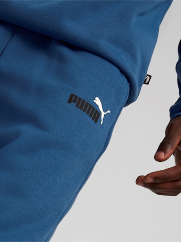 Tapered Pantaloni sport 'ESS+' de la PUMA pe albastru