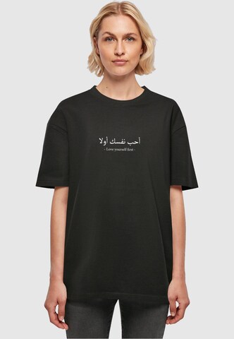 Merchcode T-Shirt 'Love Yourself First' in Schwarz: Vorderseite