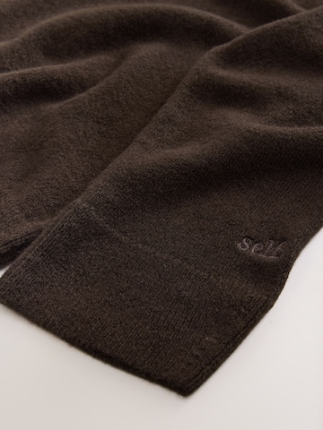 Pull-over self. en marron