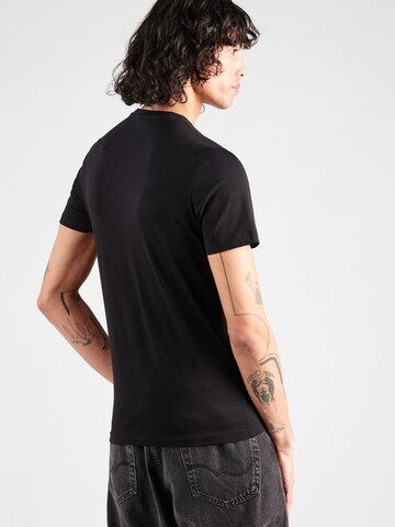 GUESS T-Shirt in Schwarz