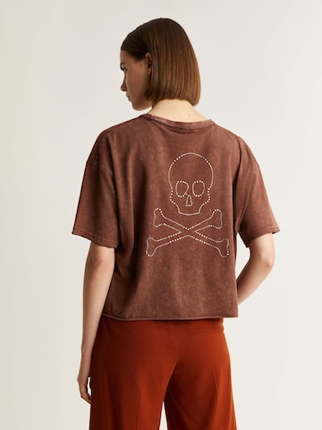 Scalpers T-shirt 'New Back Skull' i brun