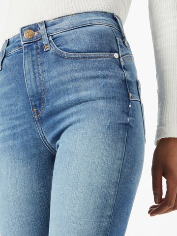 Skinny Jeans di River Island in blu