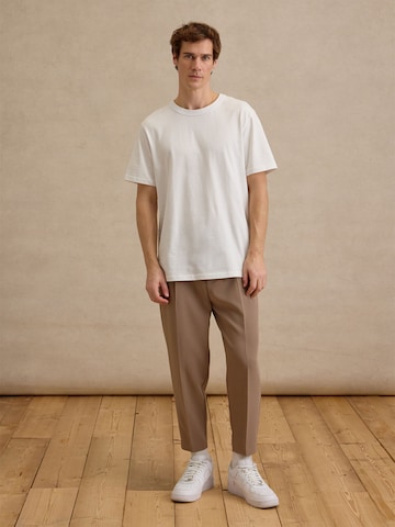 DAN FOX APPAREL Tapered Pleated Pants 'Toni' in Beige