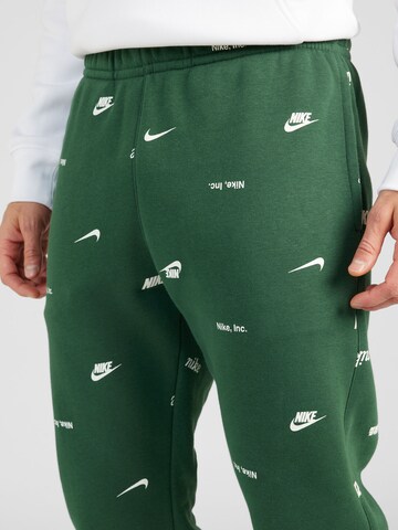 žalia Nike Sportswear Siaurėjantis Kelnės 'CLUB'